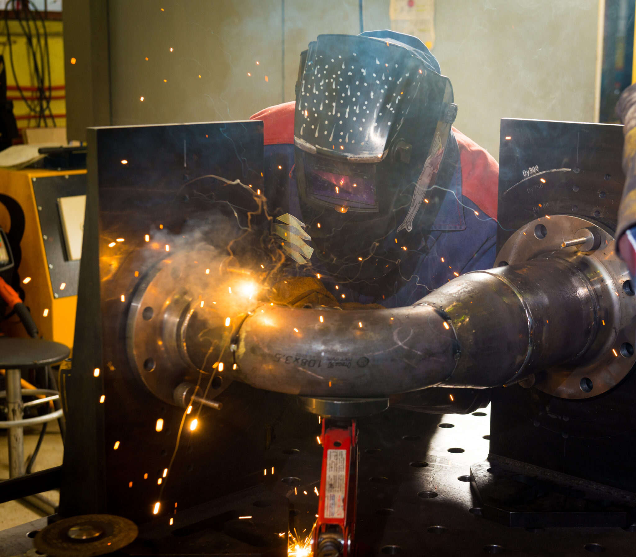 Welder working with steel